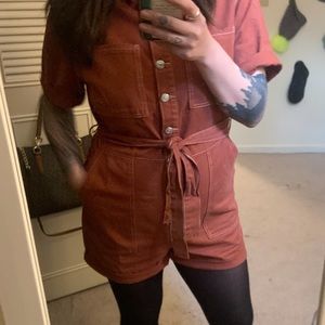 Orange jumpsuit- shorts. Very flatter fun outfit